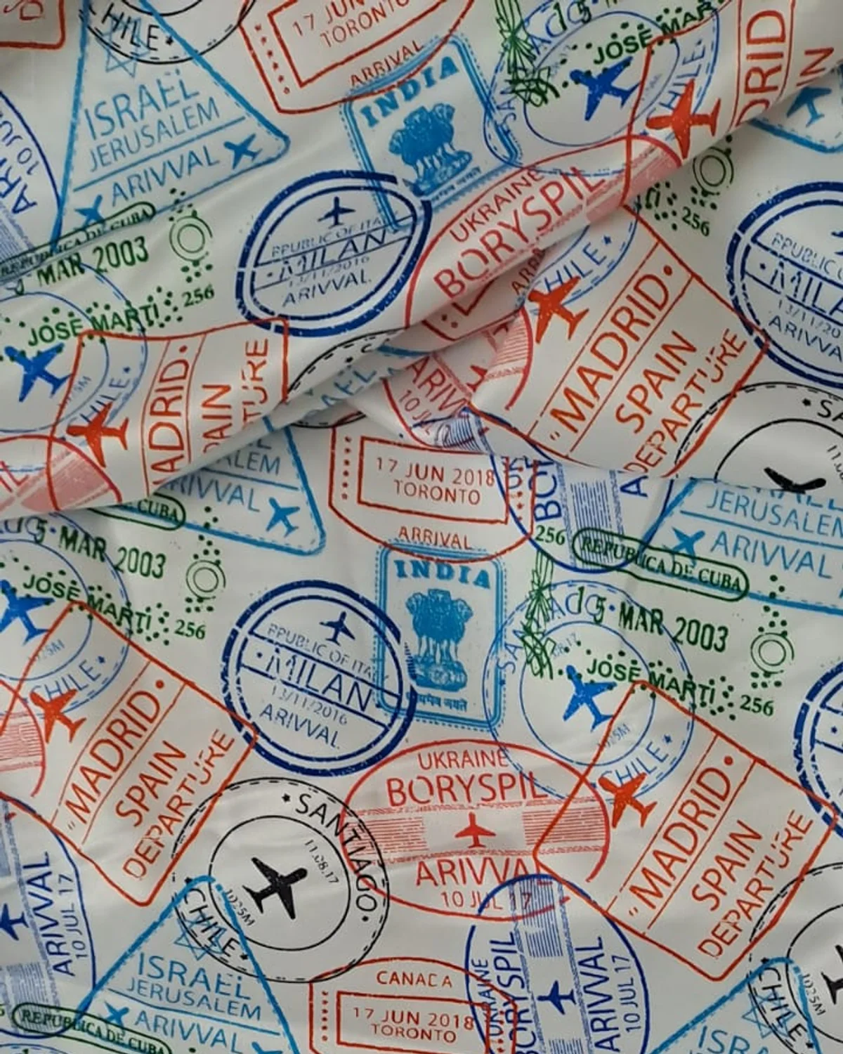 Travel-inspired custom printed lining fabric with colourful passport stamp motifs