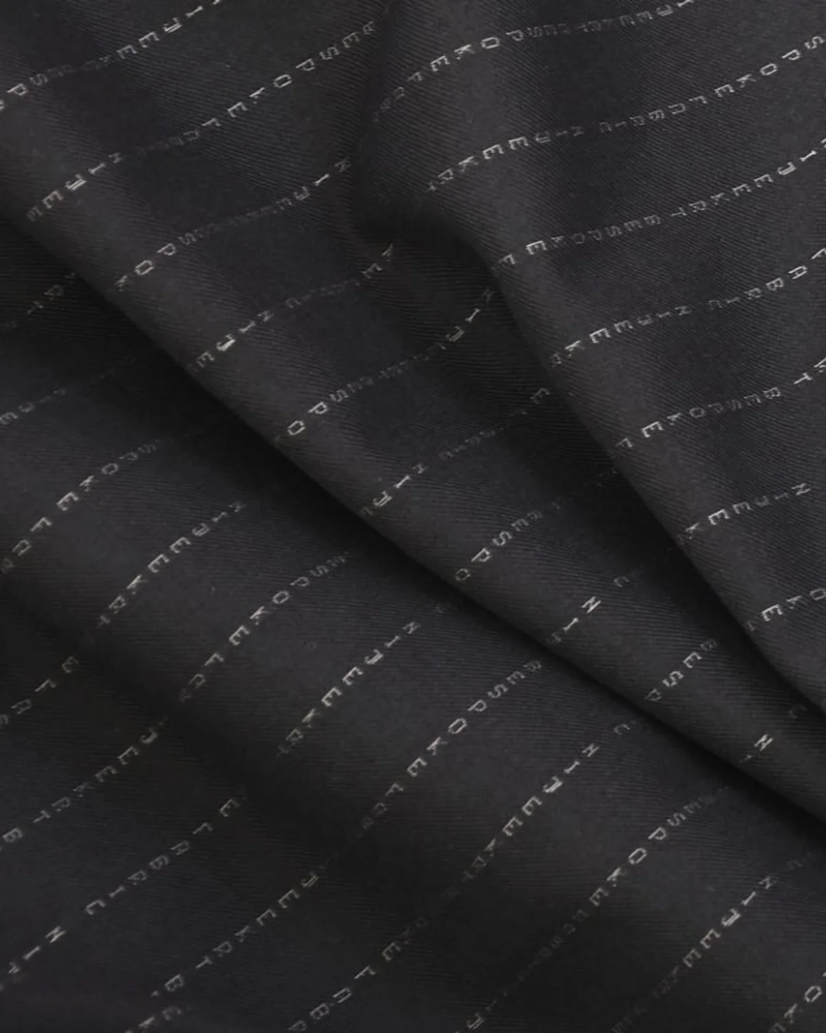 NameWoven suiting fabric with personalized name letters woven into the cloth